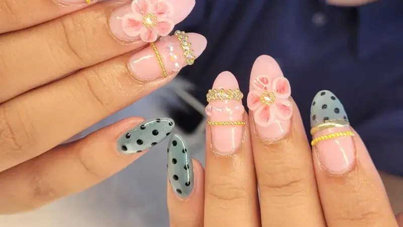Almond nails with 3D flowers, polka dots and gold beads