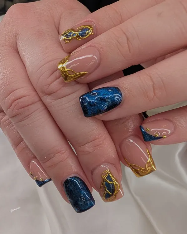 Blue cat-eye with gold chrome nail art by Divine Grace Nails Studio, Edmonton