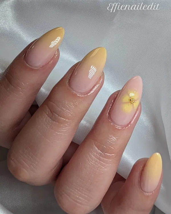 Butter yellow fade with a flower nail art by Divine Grace Nails Studio, Edmonton