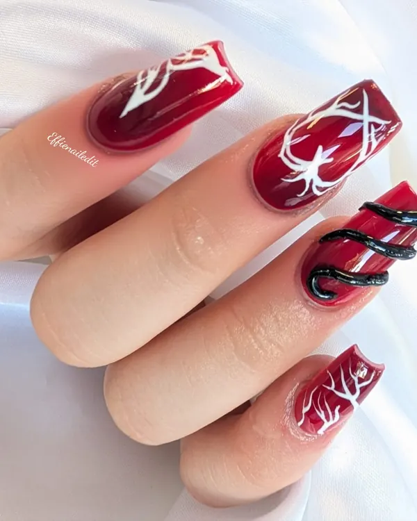 Red with white branches and a 3D snake nail art by Divine Grace Nails Studio, Edmonton