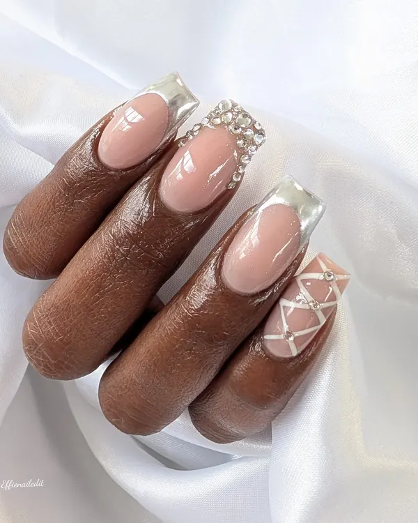 Silver chrome French with crystals nail art by Divine Grace Nails Studio, Edmonton